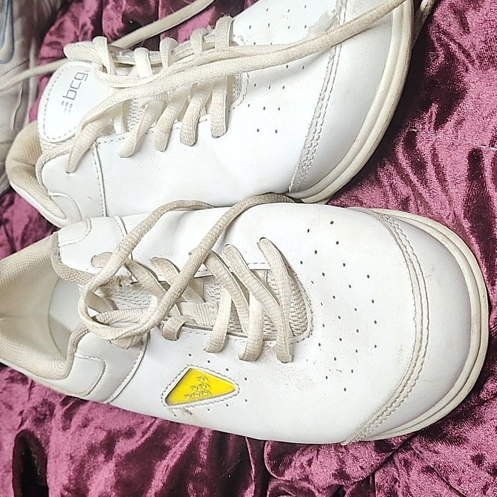 White and yellow BCG tennis shoes